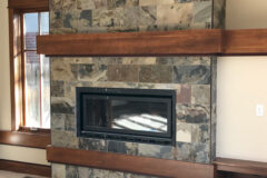 16′′ × 8′′ Slate tile with Schluter edge and solid cherry wood mantel, in Cherry Creek, Colorado