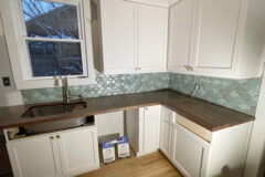 Backsplash: Ceramic tile, scalloped pattern, random colors, in Denver, Colorado