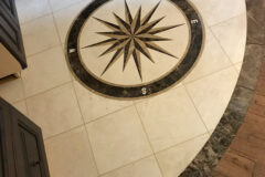 Compass Inset: 12′′ × 12′′ Marble tile with marble border, in Johnstown, Colorado