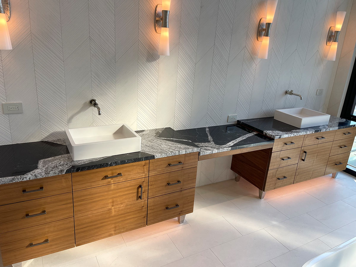Decorative Wall: 10′′ × 30′′ Limestone, chevron pattern. Bathroom Floor: Limestone 12′′ × 24′′ subway pattern (40%–60% offset), in McGregor Square, Colorado