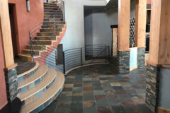 Floor: 12′′ × 12′′ Slate tile. Column Foundations: Ledger slate tile (stacked stone). Stair Risers: Custom-cut slate tile, in Westminster, Colorado