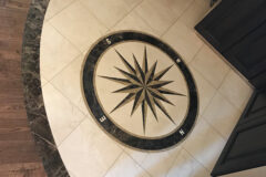 Inset Compass: 12′′ × 12′′ Marble tile with marble border, in Johnstown, Colorado