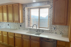 Kitchen Backsplash: 8′′ × 8′′ Porcelain tile with custom-made bullnose, in Aurora, Colorado