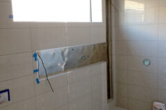 Shampoo niche with top-panel LED light and built-in vertical LED light, in Cherry Creek, Colorado