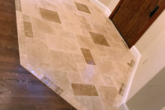 Variably sized Travertine tile, Versailles pattern, with 2′′ × 2′′ Travertine border, in Cherry Hills, Colorado